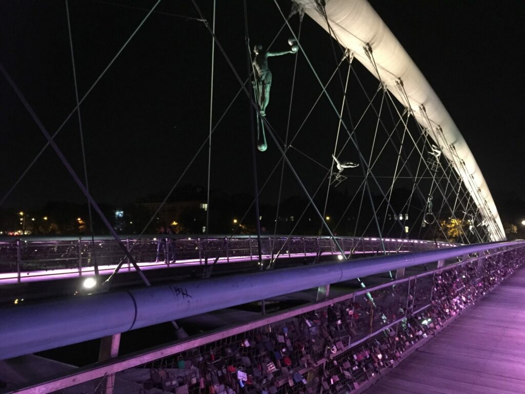 The Father Bernatek Footbridge lit up at night