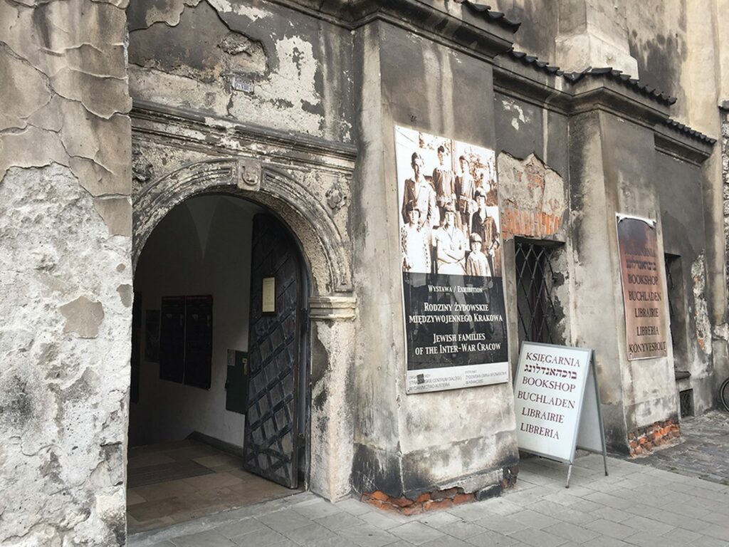 An old gateway in Kazimierz with notices about the Jewish community
