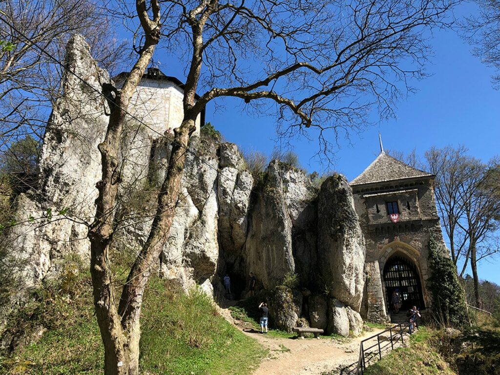 White limestone rocks and an old gate in Ojców National Park